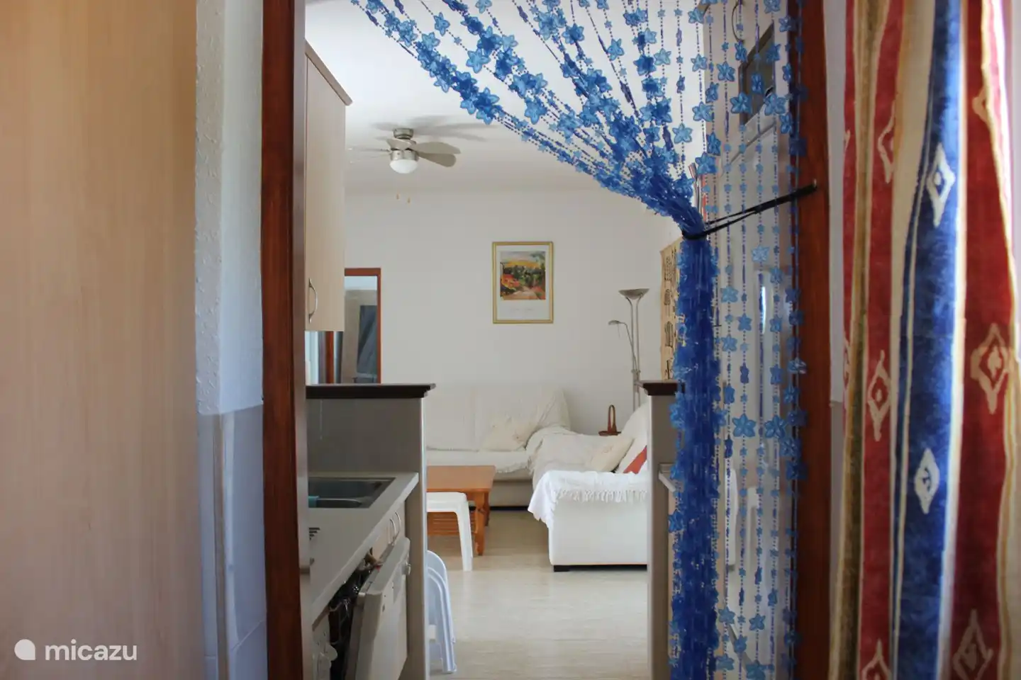 View from (utility) kitchen to sitting area