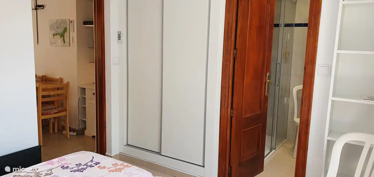 Between the living room and 3rd bedroom there is a sliding door with frosted glass. This bedroom also has a spacious built-in wardrobe and extra shelves