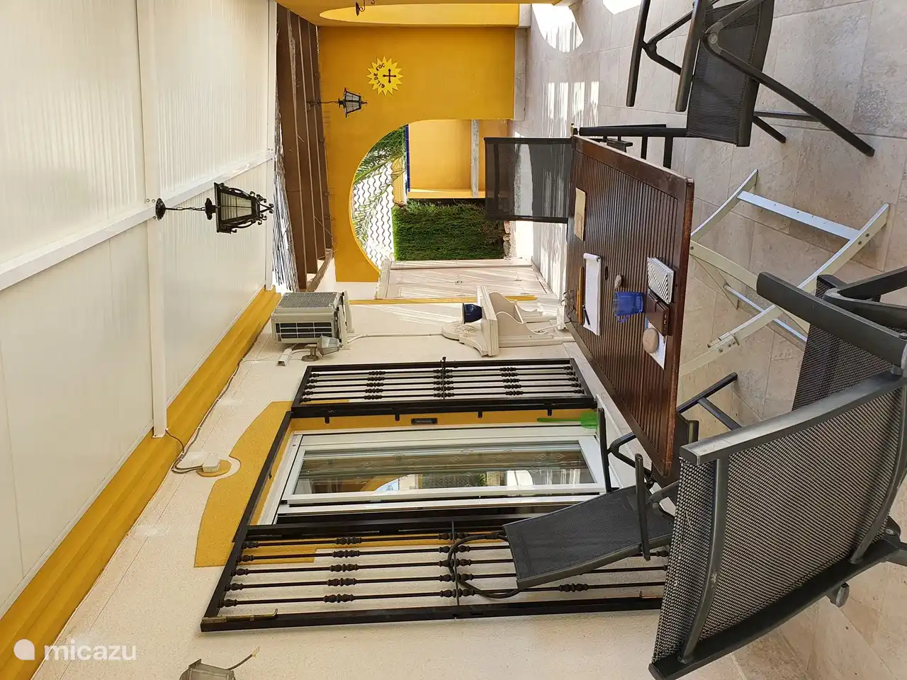 Covered terrace behind the house.