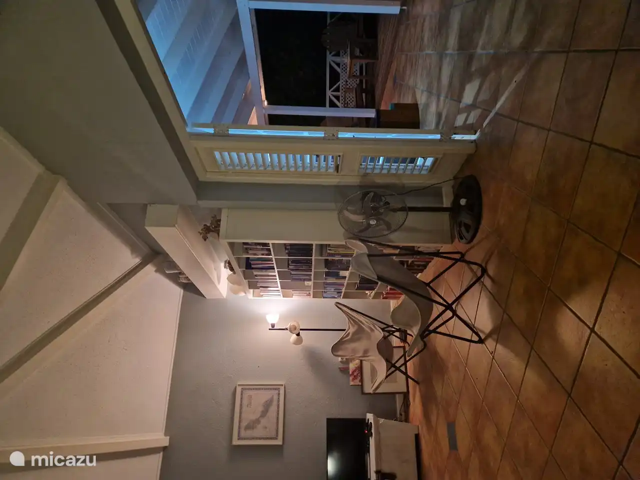 living room with TV and bookcase