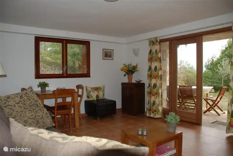 Super cozy living room with open doors in the downstairs apartment