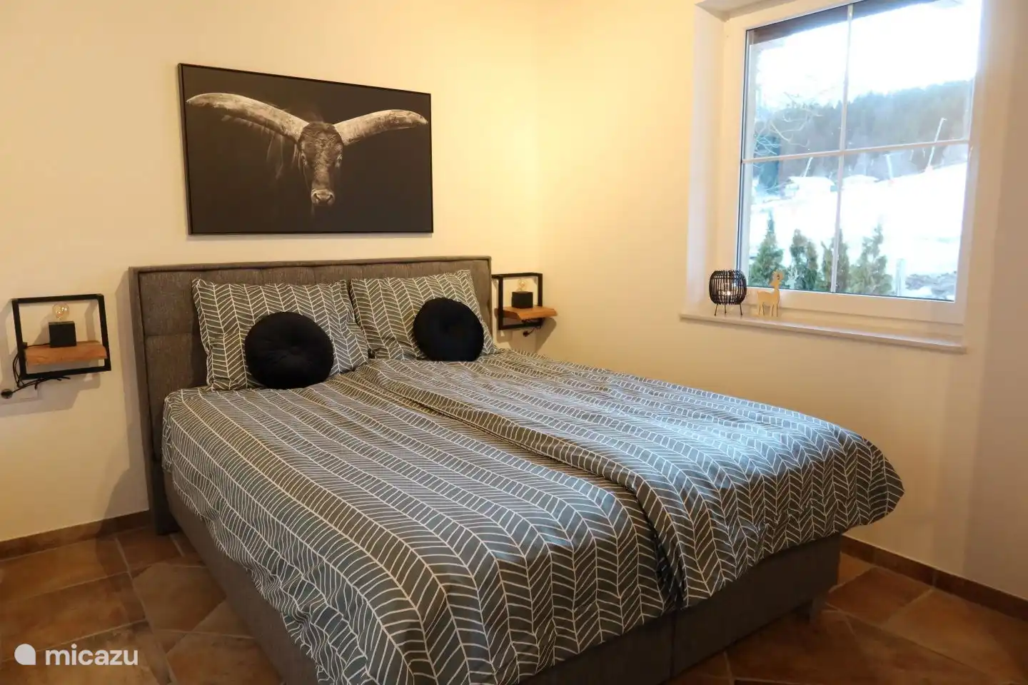 Bedroom 2 with a double bed and a view of the slopes