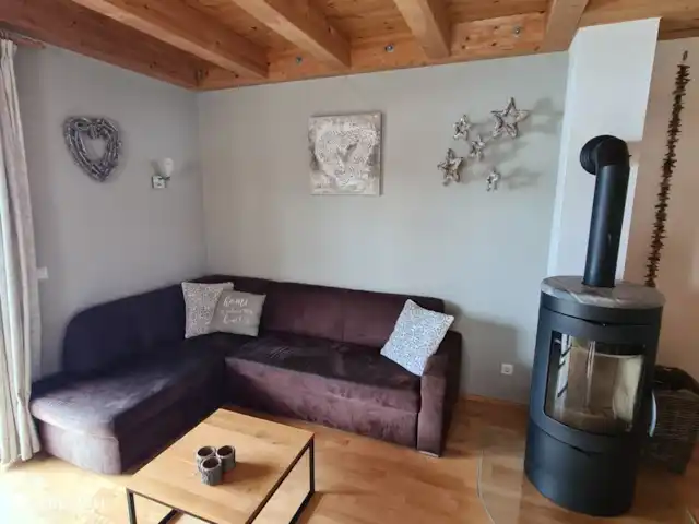 Alpenruhe | Autriche, Carinthie, Kötschach-Mauthen - maison de vacances Coin salon avec poêle à bois (bien nettoyer après utilisation)