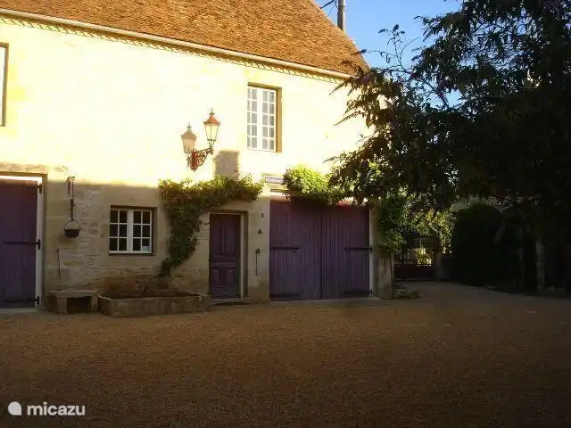 Barn in courtyard in morning sun