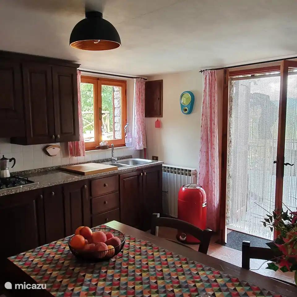 The kitchen with patio doors to the terrace