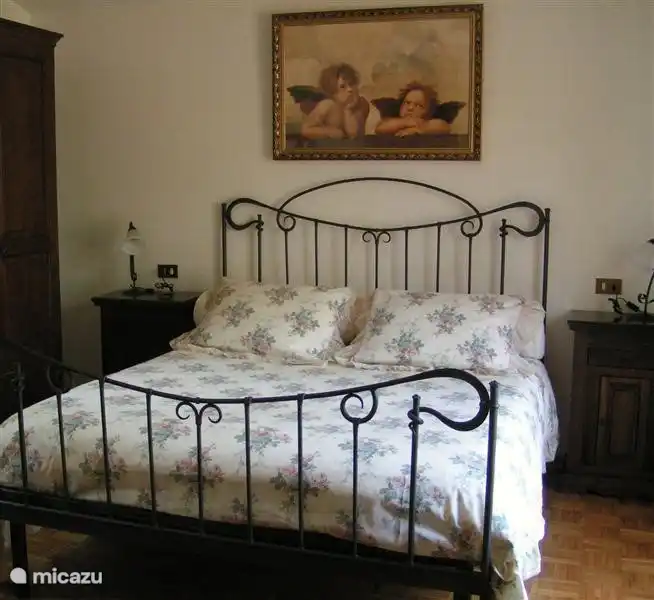 Upstairs bedroom with patio doors to the balcony